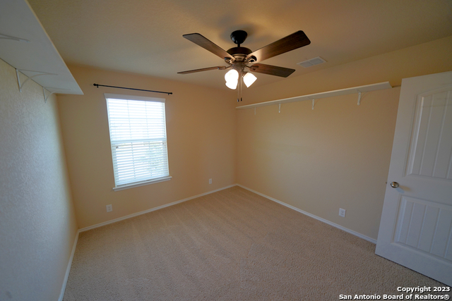 12316 Erstein Valley Schertz, TX 78154 - Photo 37 of 50 a view of a room with a ceiling fan and a window