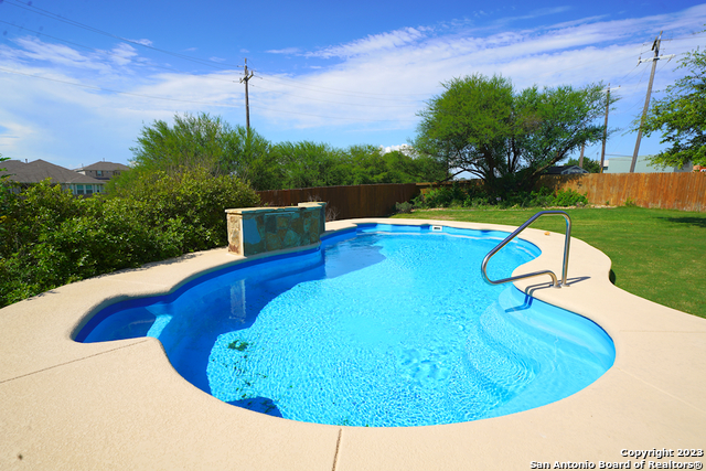 12316 Erstein Valley Schertz, TX 78154 - Photo 47 of 50 a view of a swimming pool with a yard