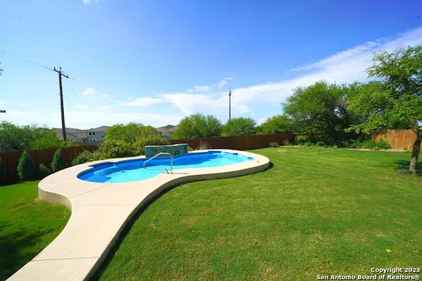 a view of a backyard with a house