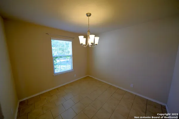 a view of a windows and chandelier in a room