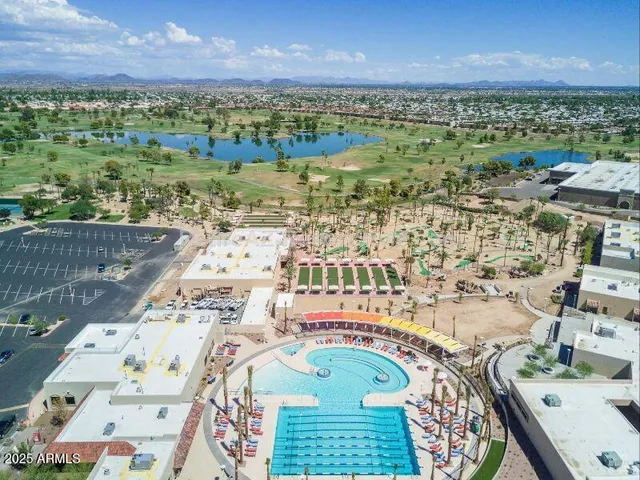 an aerial view of residential houses with outdoor space