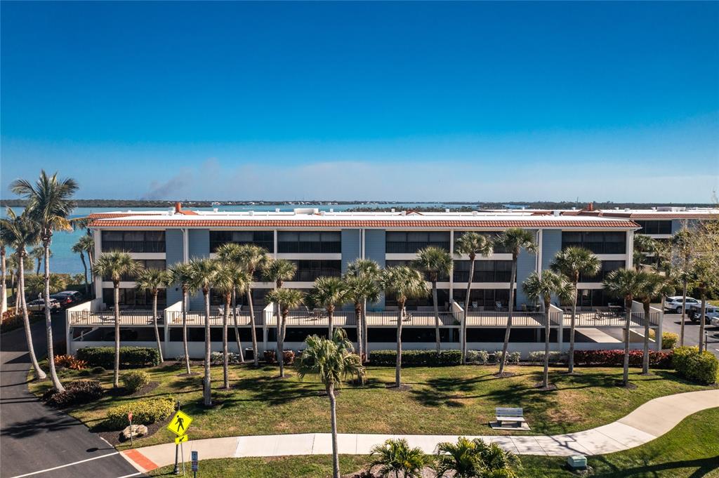 1651 Beach Road, Unit 212 Englewood, FL 34223 - Photo 1 of 50 a view of pool with outdoor seating
