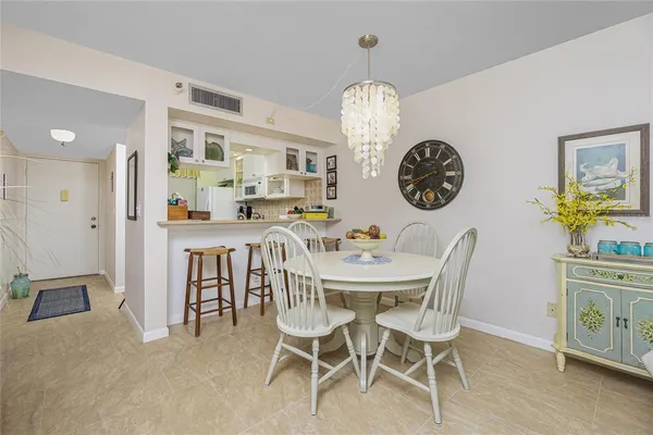 a view of a dining room and a table and chairs