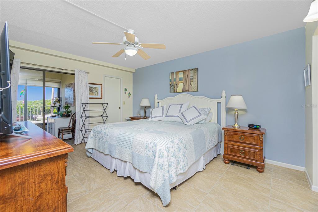 1651 Beach Road, Unit 212 Englewood, FL 34223 - Photo 20 of 50 a bedroom with bed and window