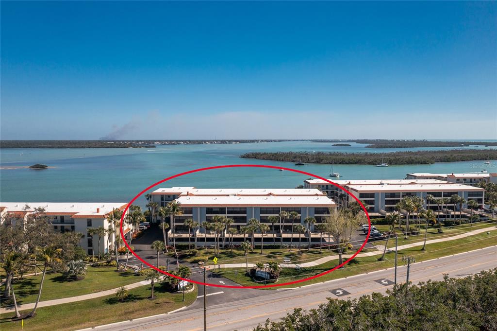 1651 Beach Road, Unit 212 Englewood, FL 34223 - Photo 32 of 50 a view of swimming pool with outdoor seating and yard in back