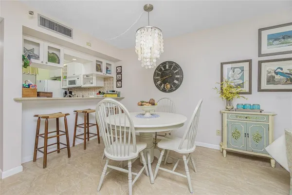 a view of a dining area with furniture and wooden floor