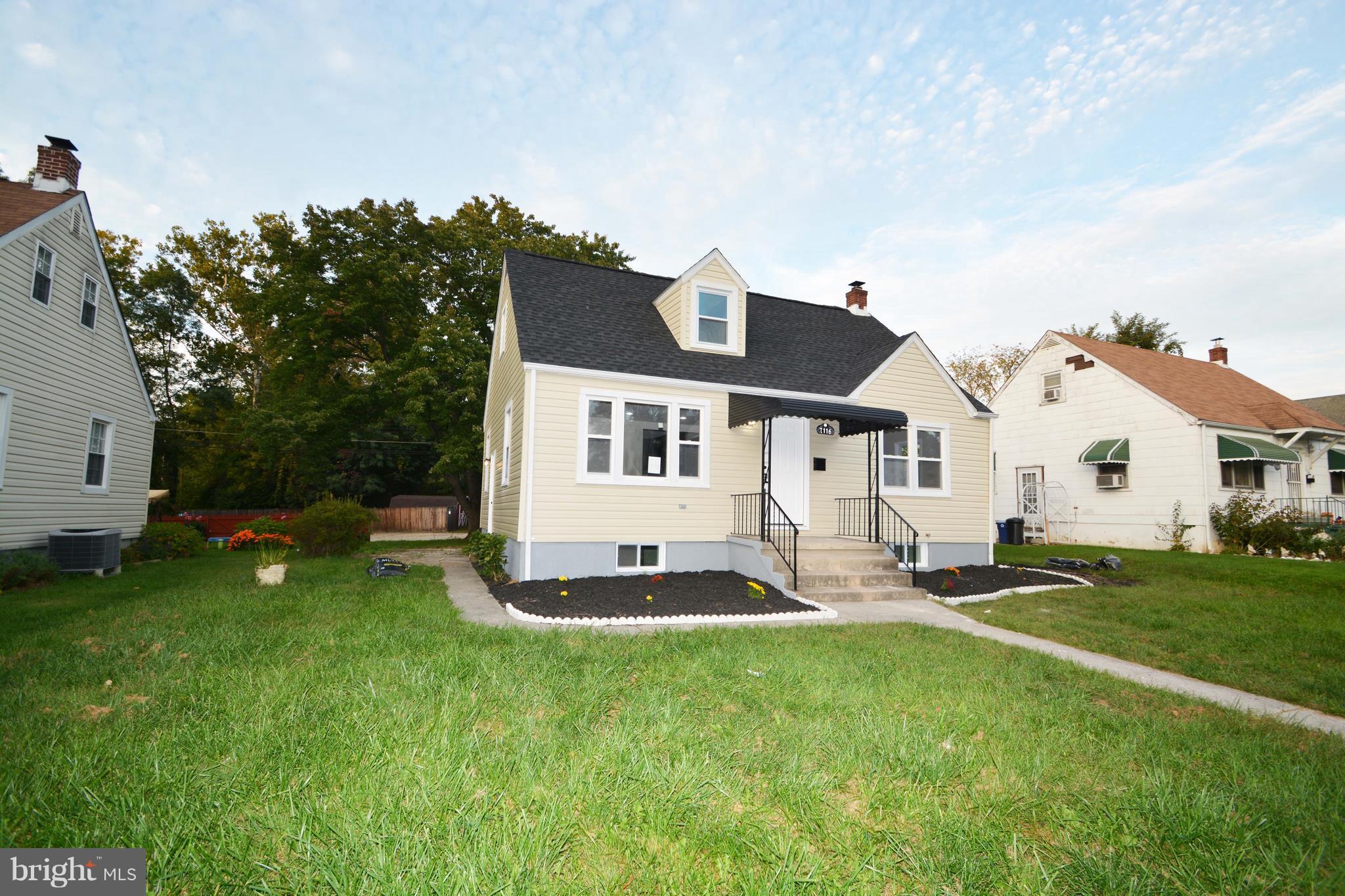 7116 Marston Road Baltimore, MD 21207 - Photo 11 of 30 a front view of house with yard and green space