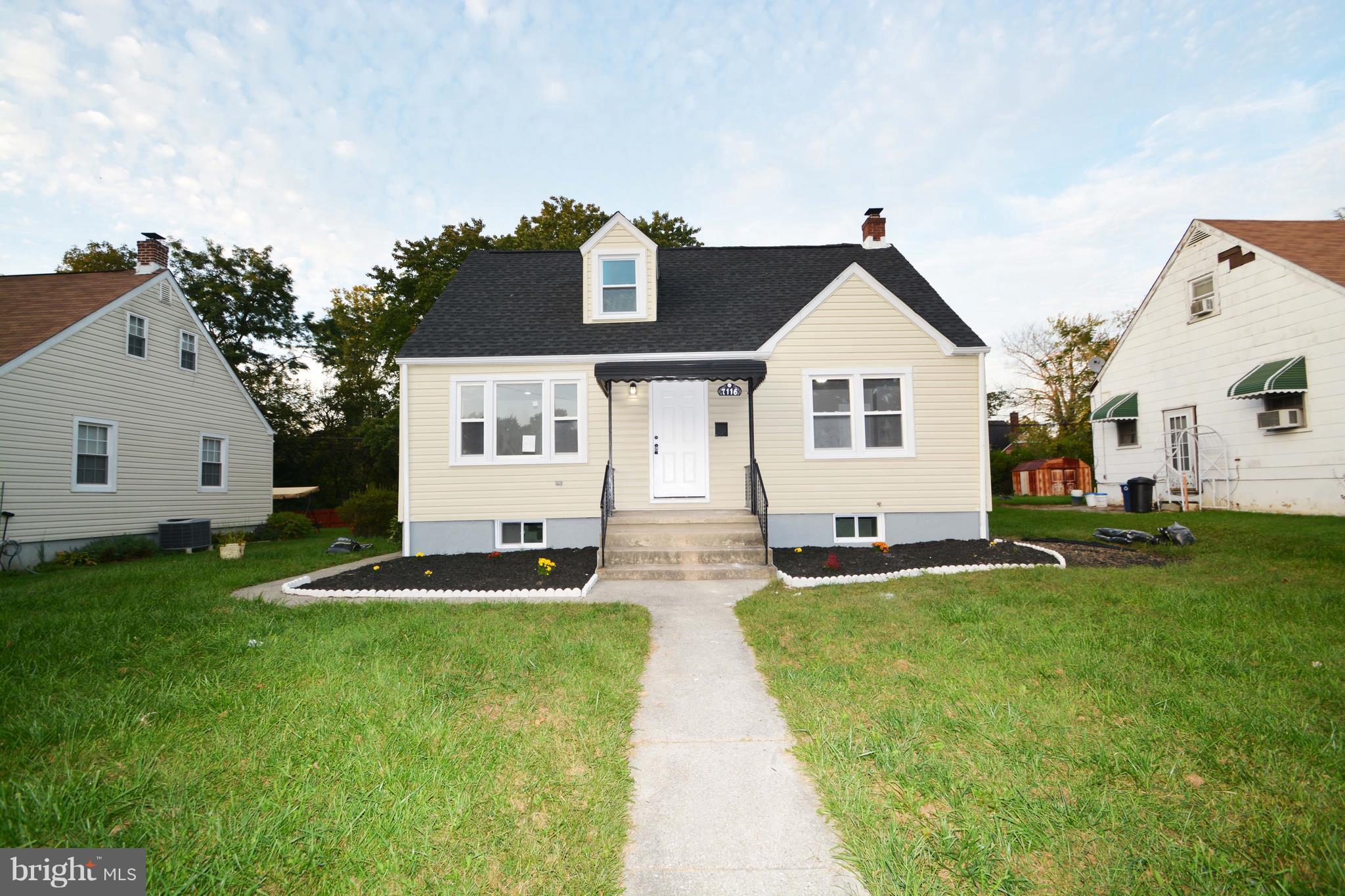 7116 Marston Road Baltimore, MD 21207 - Photo 12 of 30 a front view of a house with a yard