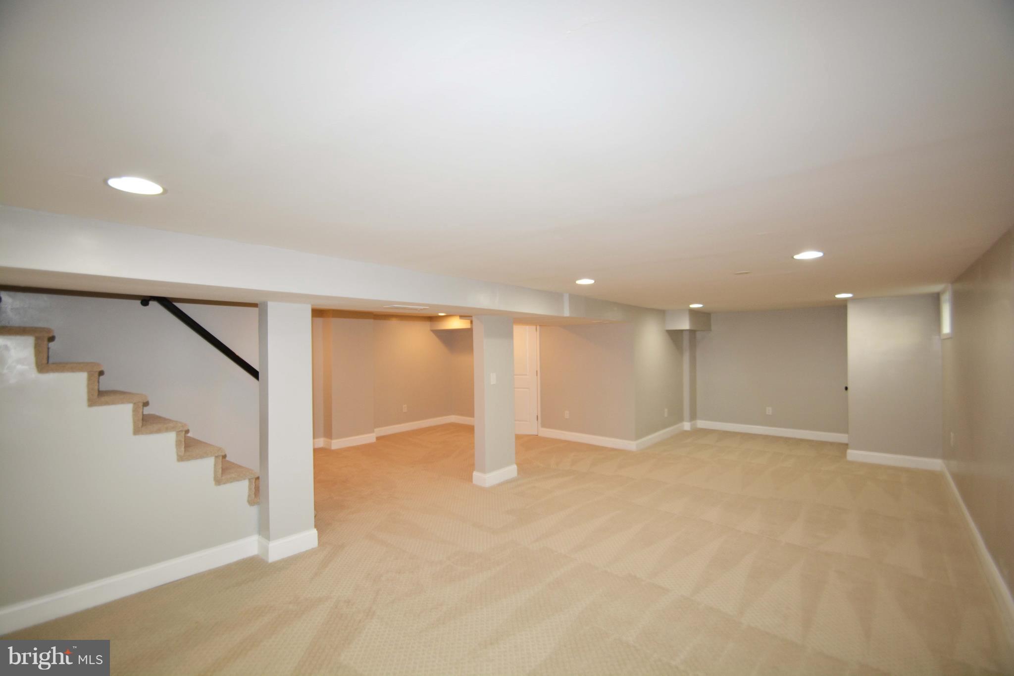 7116 Marston Road Baltimore, MD 21207 - Photo 16 of 30 an empty room with stairs and white walls