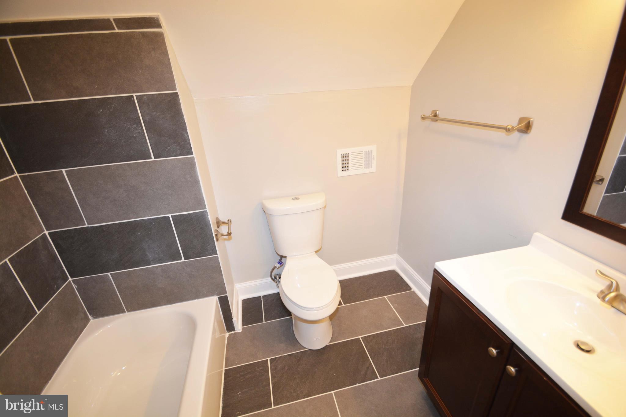 7116 Marston Road Baltimore, MD 21207 - Photo 18 of 30 a bathroom with a toilet and a sink