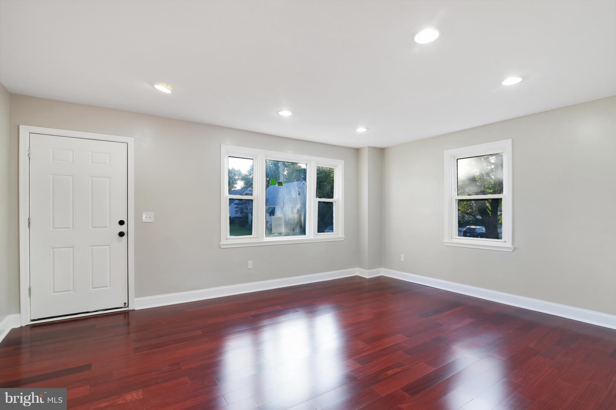 7116 Marston Road Baltimore, MD 21207 - Photo 24 of 30 a view of an empty room with wooden floor and a window
