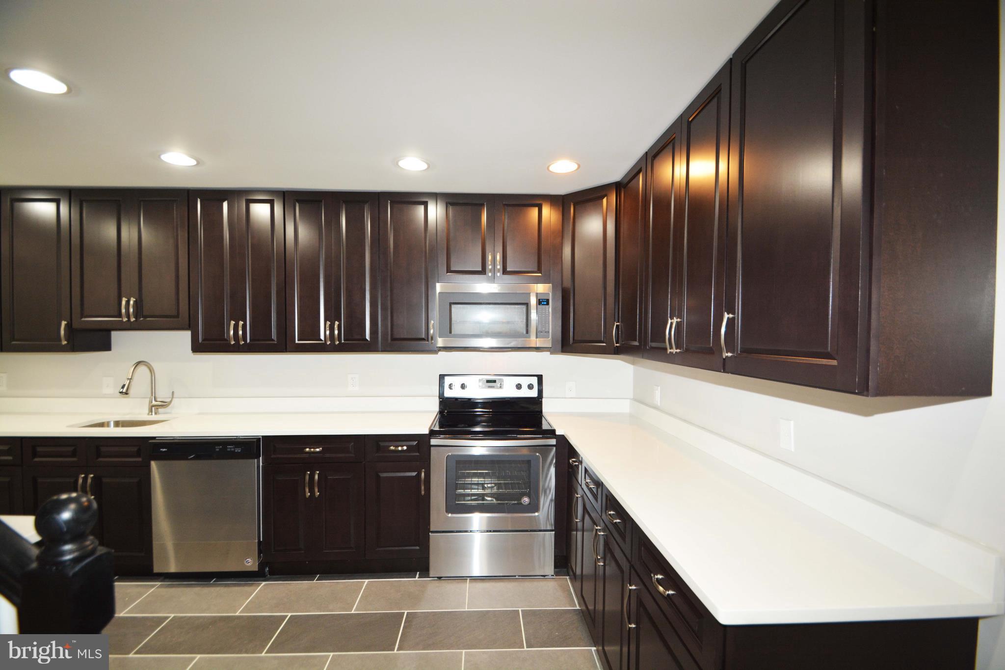 7116 Marston Road Baltimore, MD 21207 - Photo 25 of 30 a kitchen with a sink and cabinets