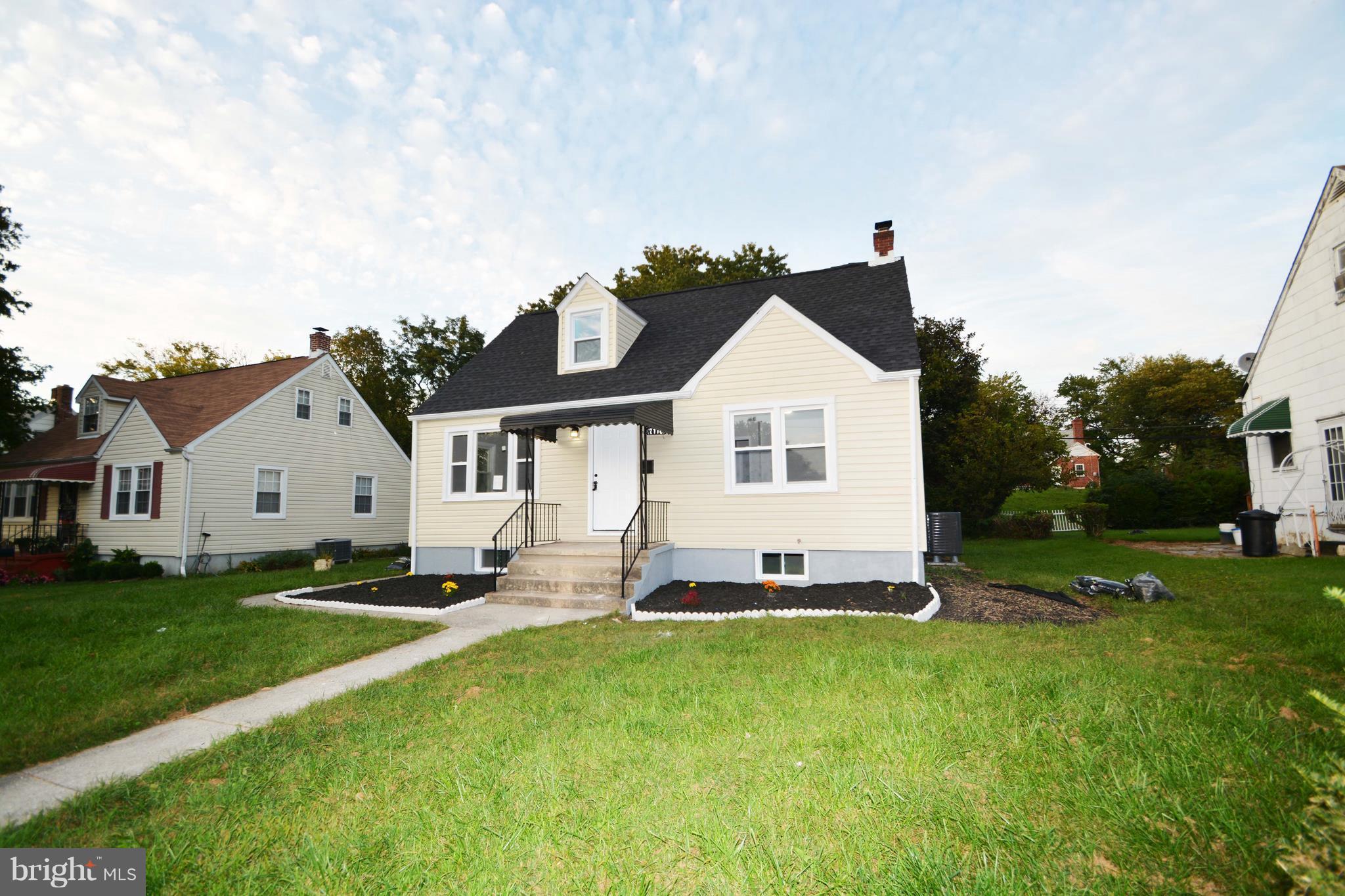 7116 Marston Road Baltimore, MD 21207 - Photo 10 of 30 a front view of a house with a yard