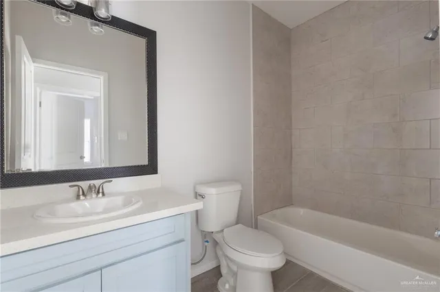 a bathroom with a sink toilet and bathtub