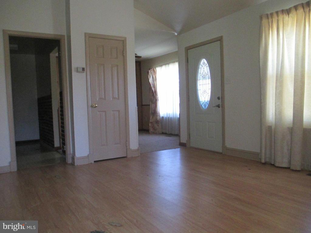 400 Laburnum Road Edgewood, MD 21040 - Photo 2 of 23 an empty room with wooden floor and windows