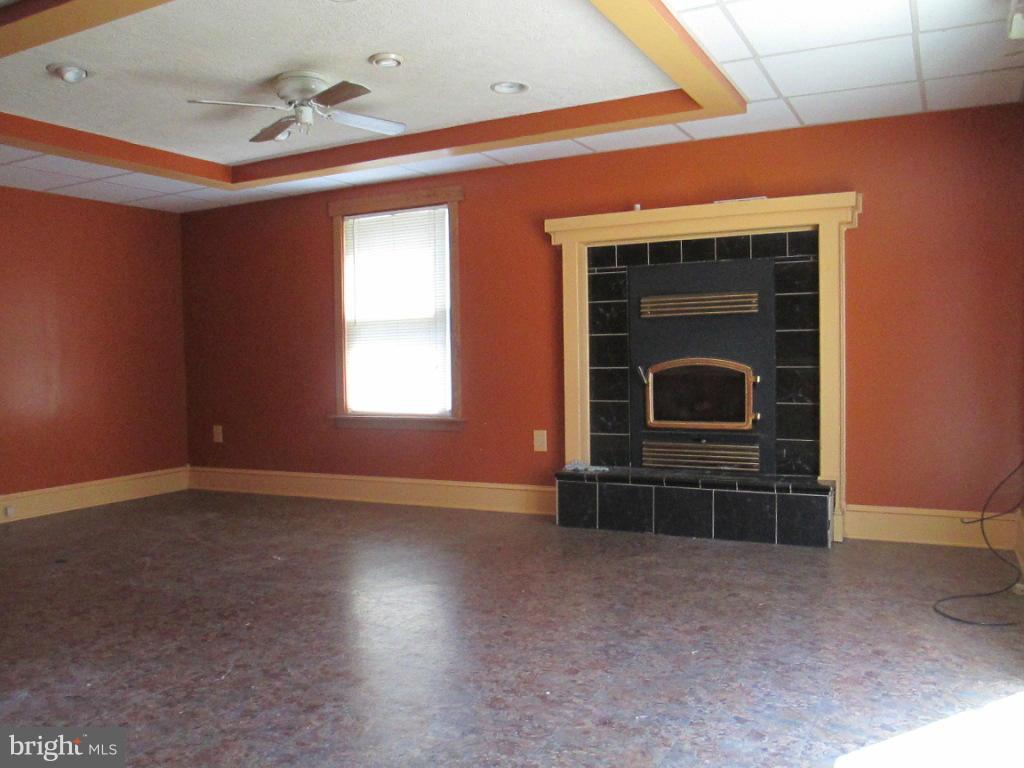 400 Laburnum Road Edgewood, MD 21040 - Photo 18 of 23 a view of an empty room with furniture and a fireplace