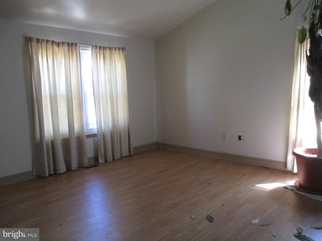 400 Laburnum Road Edgewood, MD 21040 - Photo 3 of 23 an empty room with wooden floor and windows