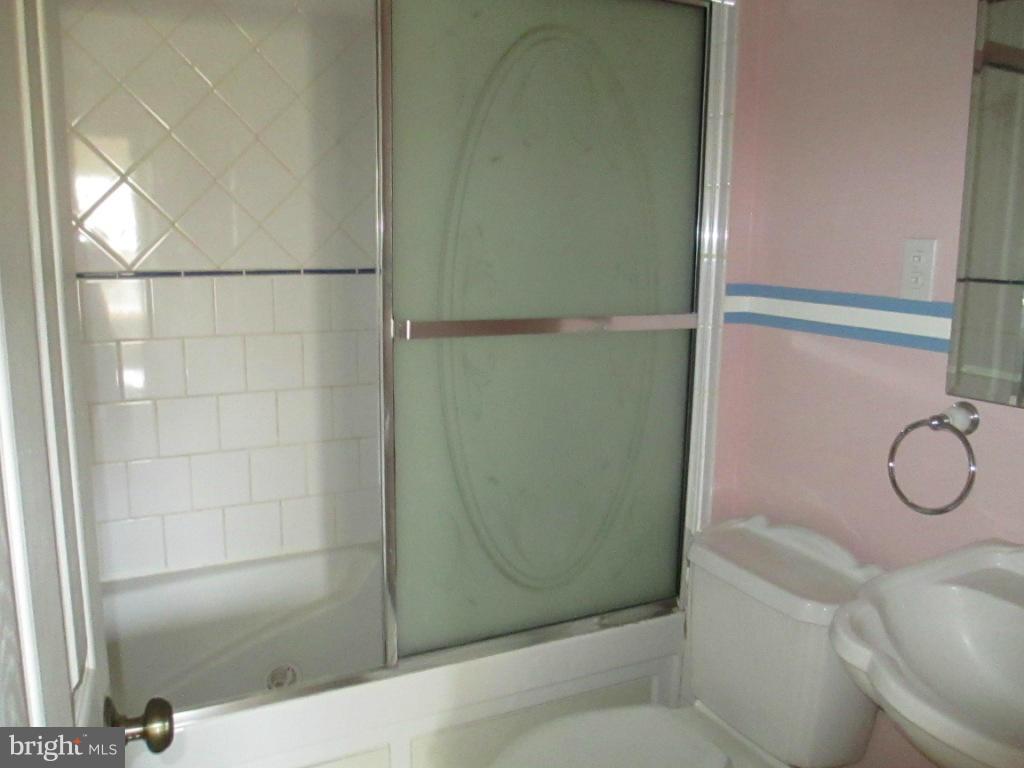 400 Laburnum Road Edgewood, MD 21040 - Photo 10 of 23 a bathroom with a glass shower door