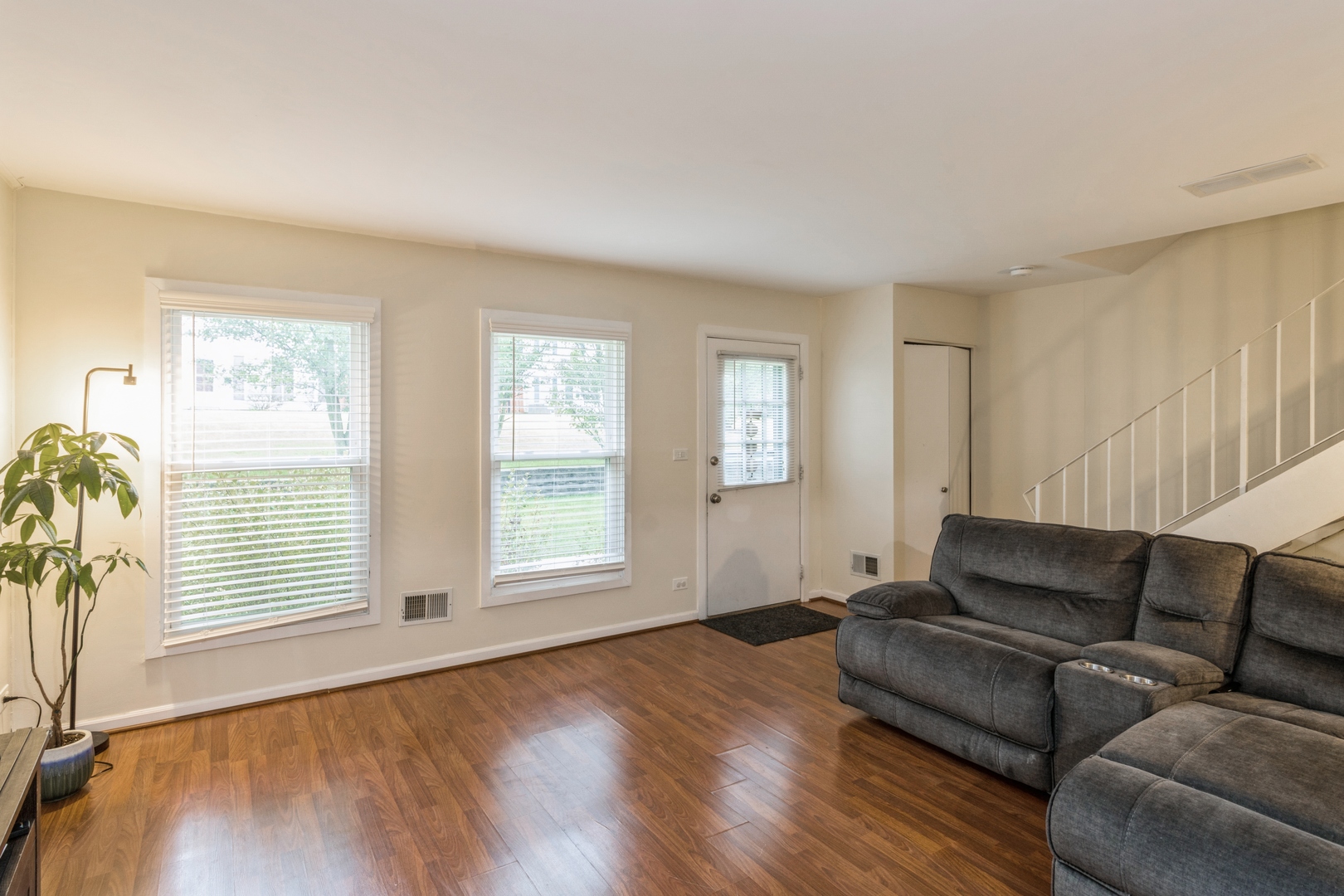 1881 Jamestown Circle Hoffman Estates, IL 60169 - Photo 3 of 11 a living room with furniture and a window