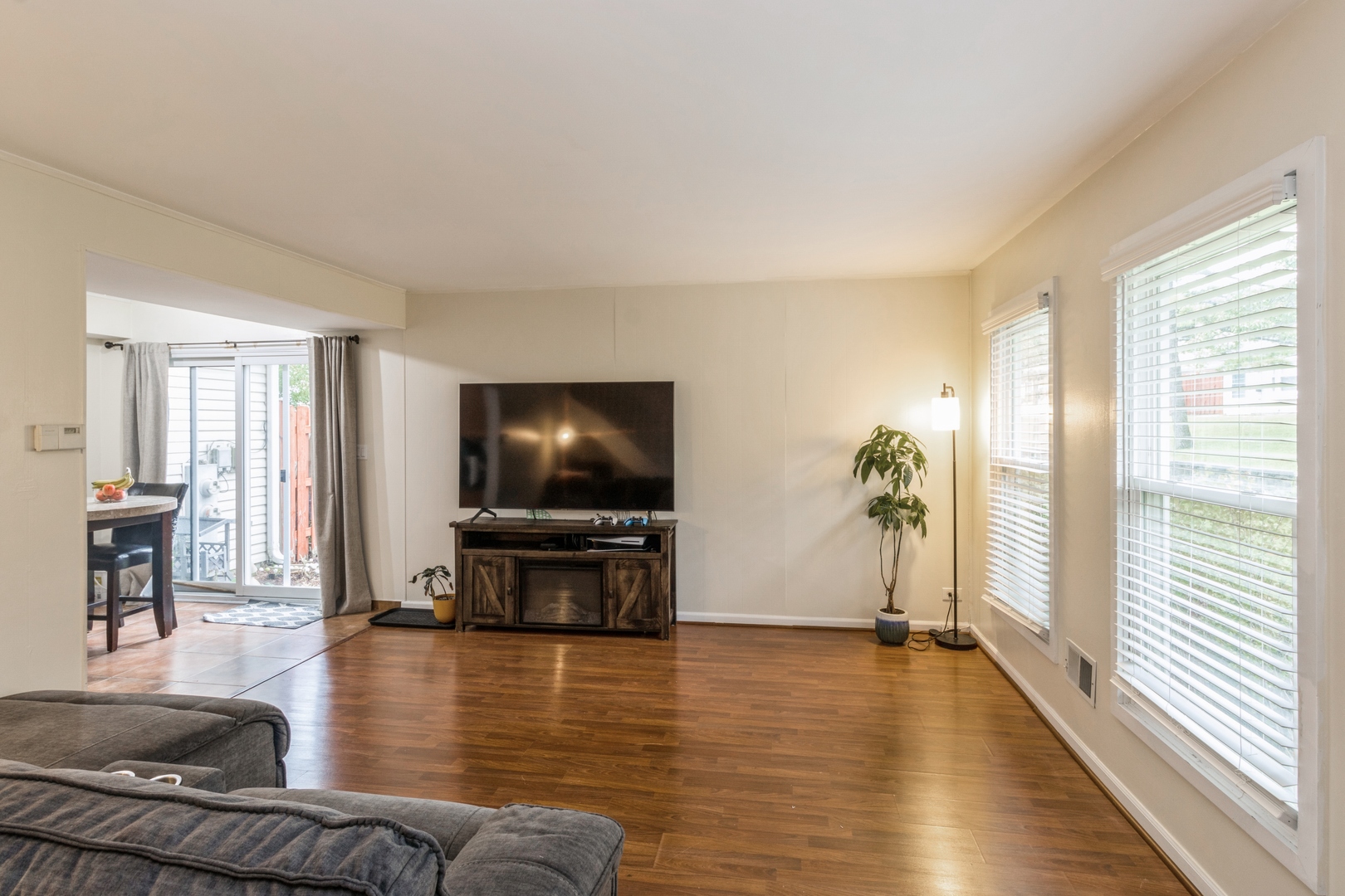 1881 Jamestown Circle Hoffman Estates, IL 60169 - Photo 4 of 11 a living room with furniture floor to ceiling window and wooden floor