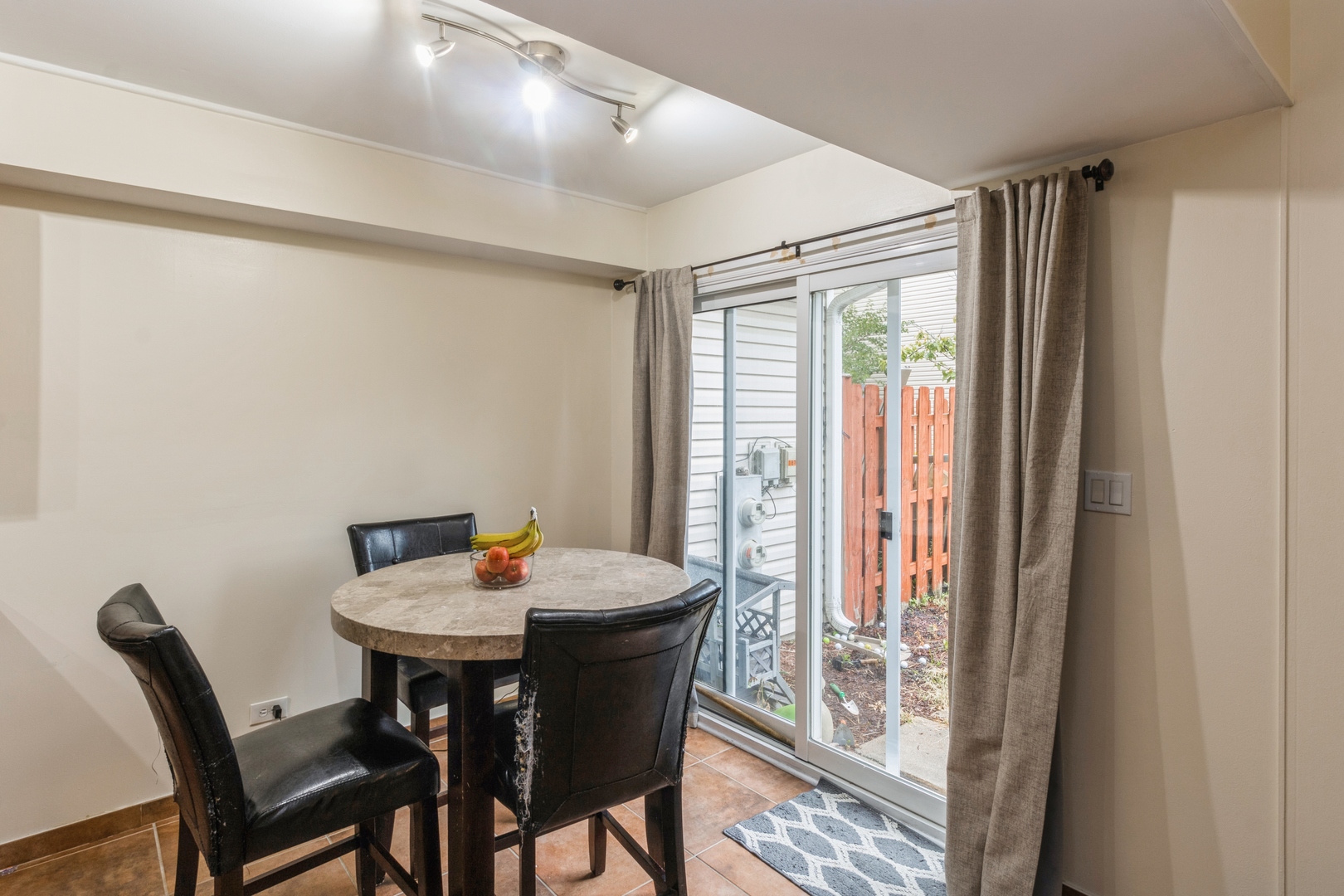 1881 Jamestown Circle Hoffman Estates, IL 60169 - Photo 7 of 11 a view of a dining room with furniture window and outside view
