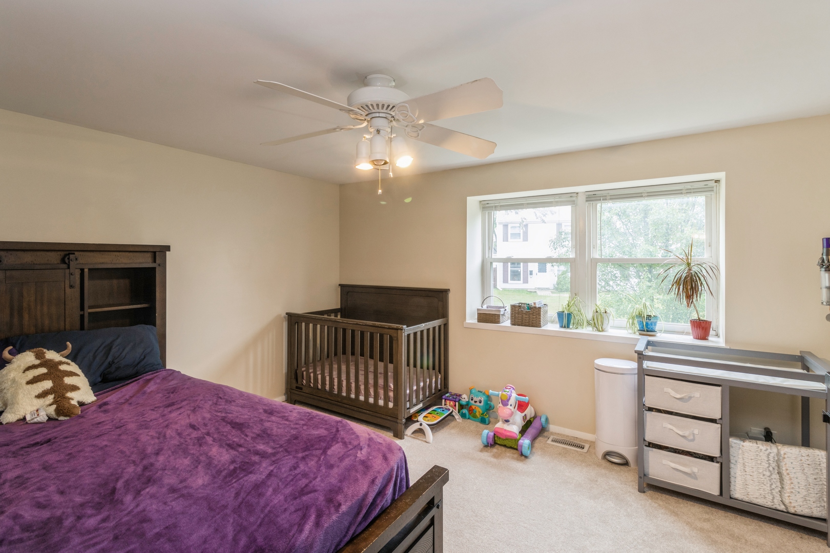 1881 Jamestown Circle Hoffman Estates, IL 60169 - Photo 8 of 11 a bedroom with furniture and a window