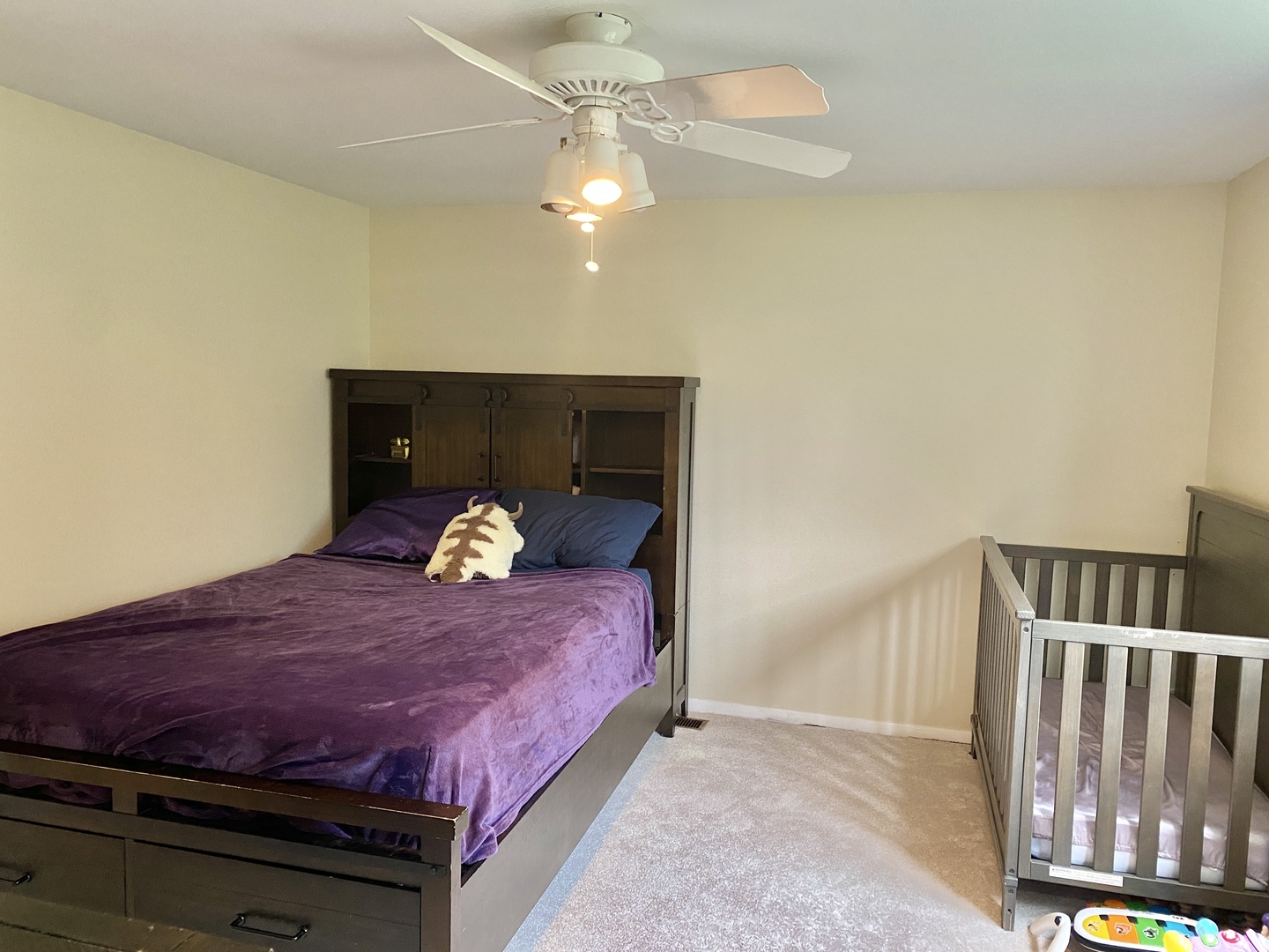 1881 Jamestown Circle Hoffman Estates, IL 60169 - Photo 9 of 11 a large bed sitting in a bedroom next to a cabinet