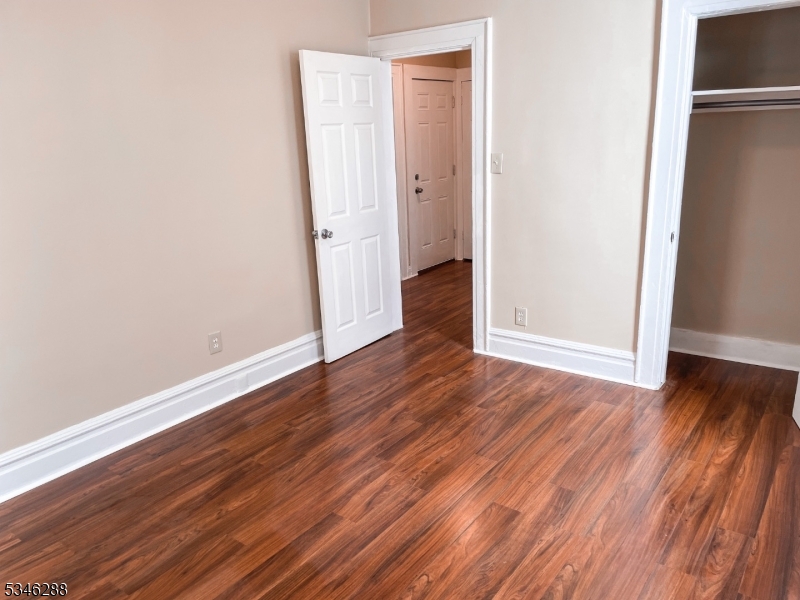 596 South 19th Street Newark, NJ 07103 - Photo 6 of 9 a view of a room with wooden floor