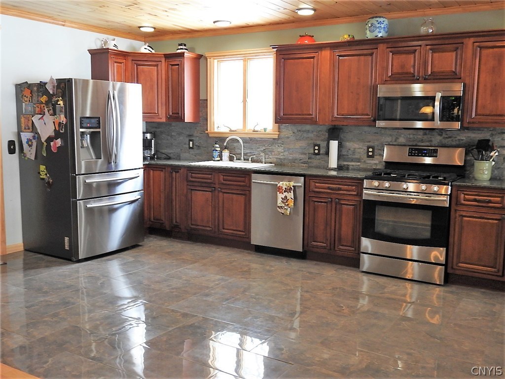 5771 Long Point Road Brantingham, NY 13312 - Photo 11 of 49 Behind the refrigerator there is a closet for the