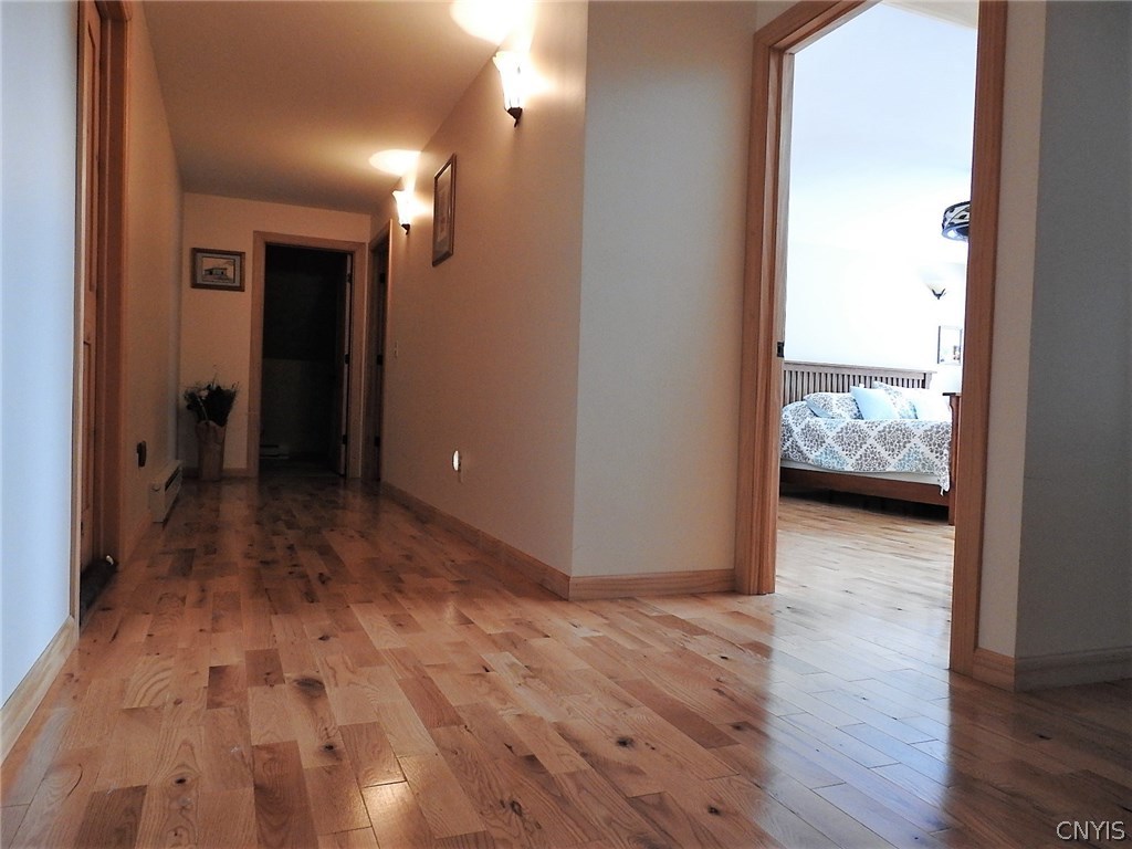 5771 Long Point Road Brantingham, NY 13312 - Photo 20 of 49 Over sized hall way. Door to the left is access to