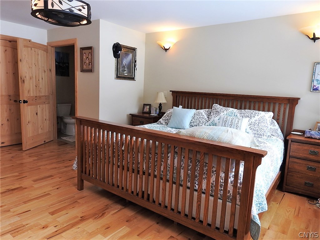 5771 Long Point Road Brantingham, NY 13312 - Photo 21 of 49 Largest Bedroom with Half Bath. All doors in the h