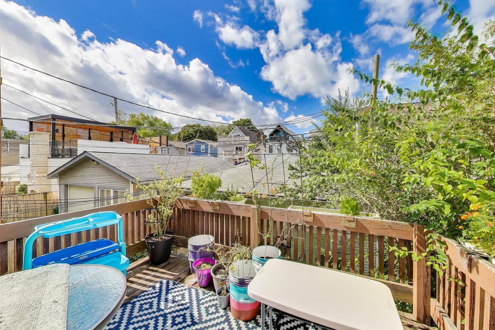 4154 North Campbell Avenue Chicago, IL 60618 - Photo 11 of 28 a view of a chairs and table on the deck