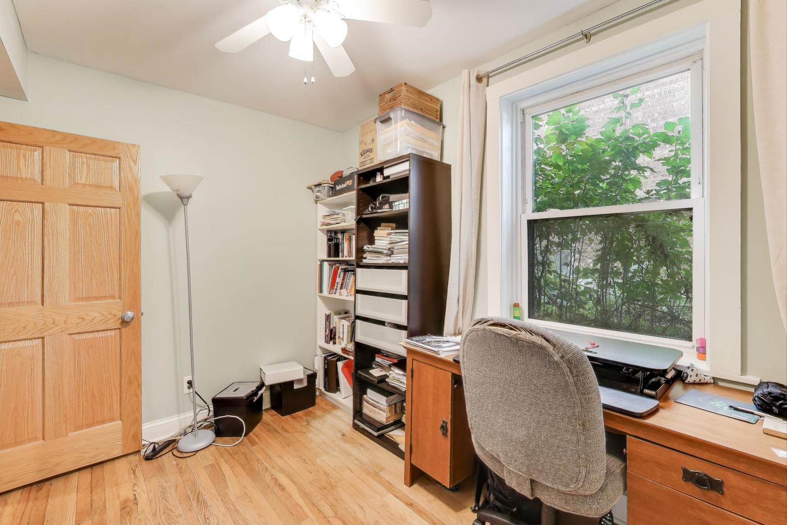 4154 North Campbell Avenue Chicago, IL 60618 - Photo 12 of 28 a view of a workspace with furniture and a window