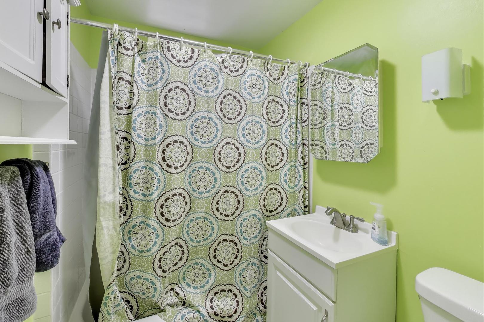4154 North Campbell Avenue Chicago, IL 60618 - Photo 13 of 28 a bathroom with a sink toilet and shower