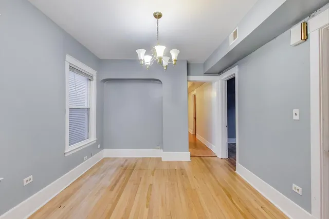 a kitchen with stainless steel appliances granite countertop a refrigerator a stove a sink and a microwave