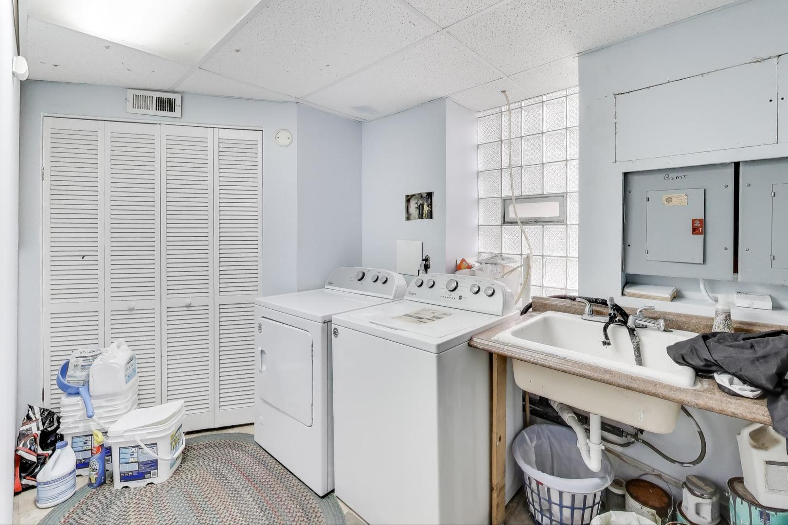 4154 North Campbell Avenue Chicago, IL 60618 - Photo 24 of 28 a bathroom with a sink a toilet and a mirror