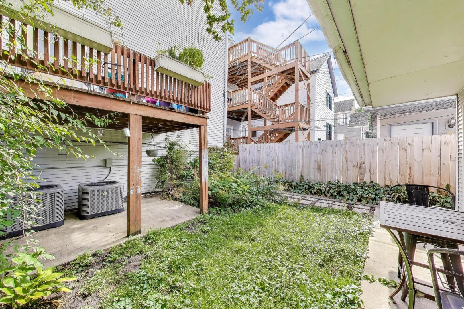 4154 North Campbell Avenue Chicago, IL 60618 - Photo 27 of 28 a view of a house with backyard and sitting area