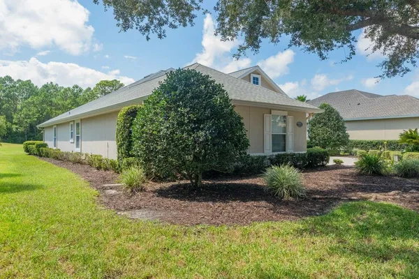 a view of empty room with fireplace and large window