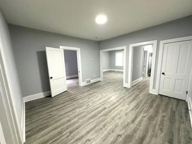 a view of entryway with wooden floor