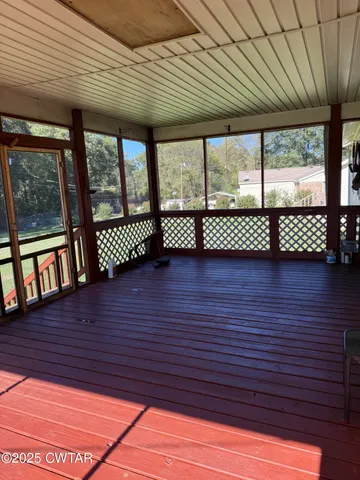 a view of front door with wooden floor