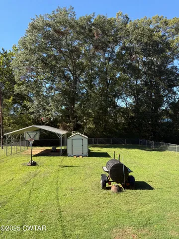 a view of a swimming pool with a bench