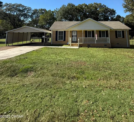 a front view of a house with yard