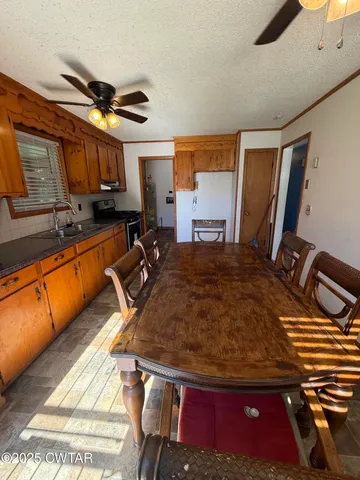 a bed sitting in a room next to a window
