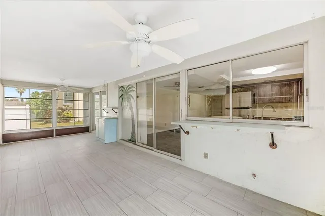 a large house with a big yard and large trees