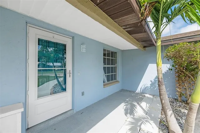 a view of a bedroom with furniture and front door