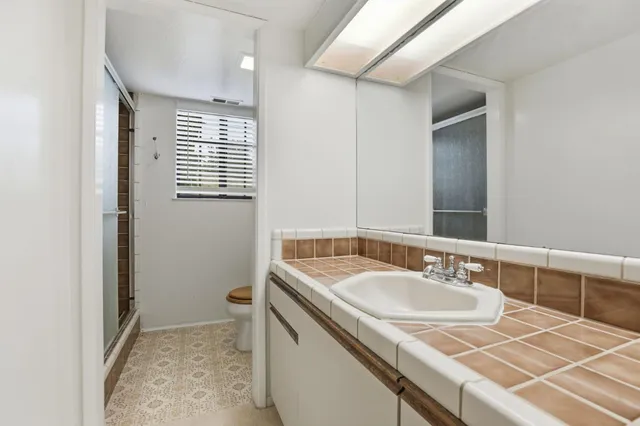 a view of an empty room with a fireplace