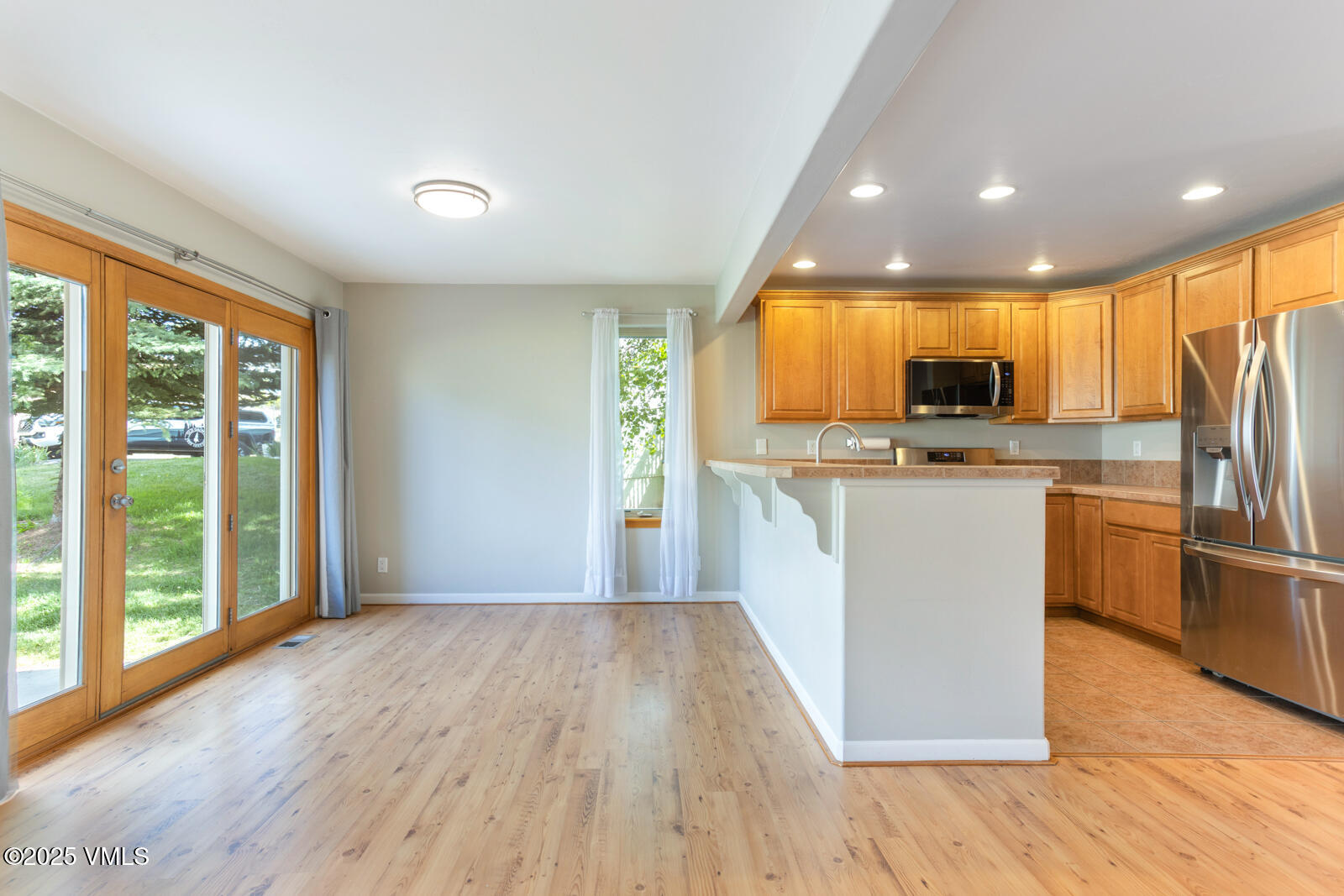 60 Mill Road, Unit J1 Eagle, CO 81631 - Photo 11 of 31 a view of kitchen with cabinets and wooden floor