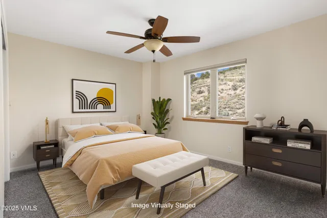 a bedroom with a bed and a couch