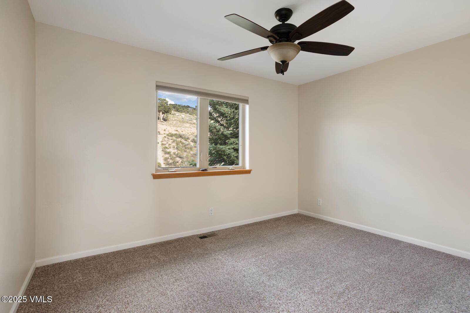 60 Mill Road, Unit J1 Eagle, CO 81631 - Photo 20 of 31 an empty room with a window and a fan