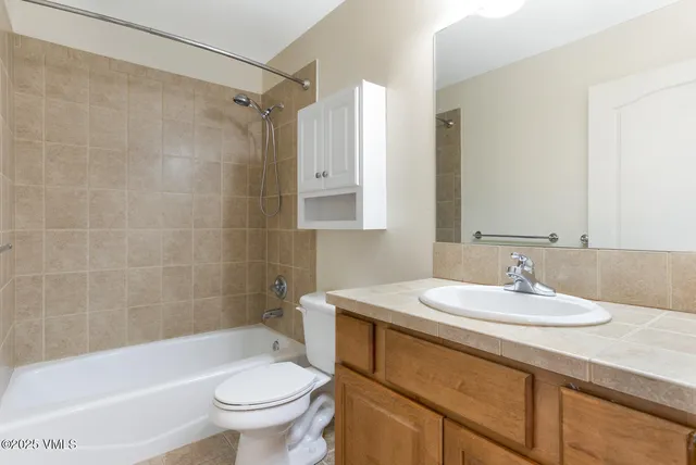 a bathroom with a sink a toilet and a bathtub
